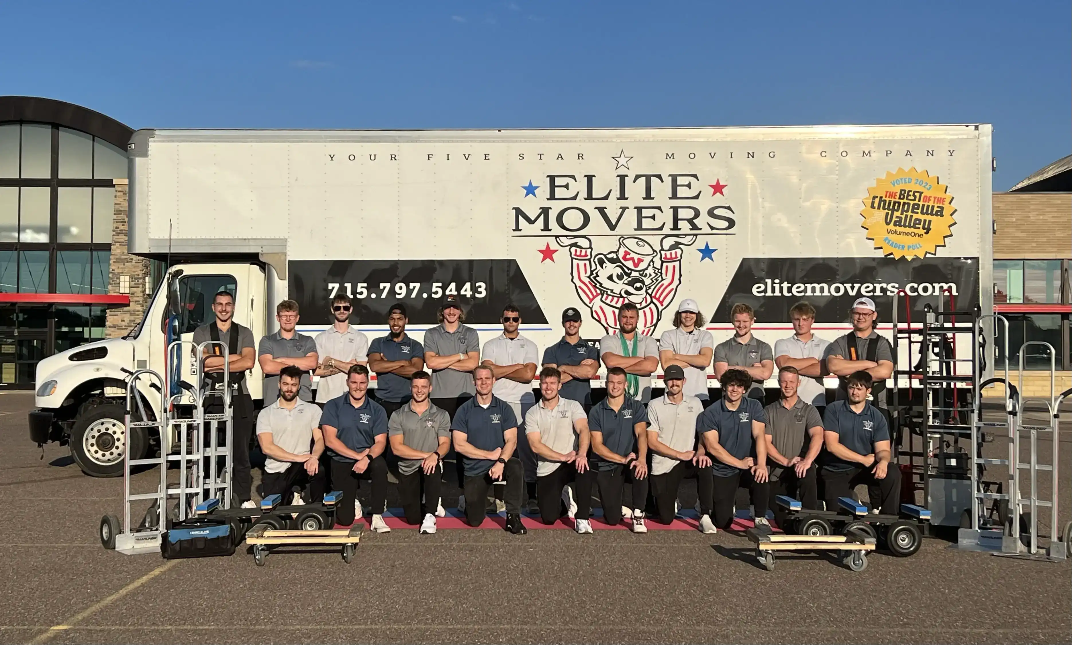 The Elite Movers team in front of the moving truck